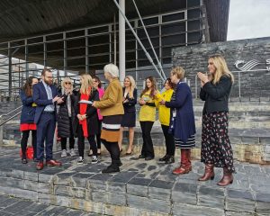 Beth Hales, FTWW Volunteer, presents the petition to Jenny Rathbone and a number of MSes.