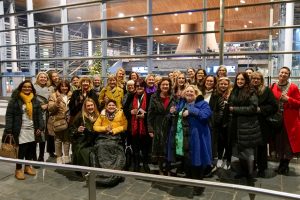 The First Minister and the Minister for Mental Health and Wellbeing are joined by members of the Women's Health Wales Coalition and FTWW Volunteers on the Senedd steps, smiling at the camera together